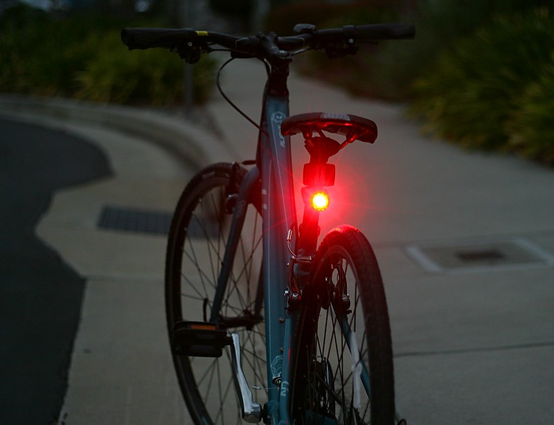Bicycle with red rear safety light attached to seat post
